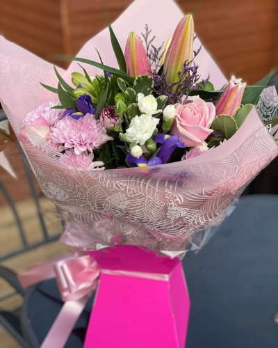 Pink Perfection - A beautiful bouquet of soft pink, white and purple tones, complemented by lush green foliage.