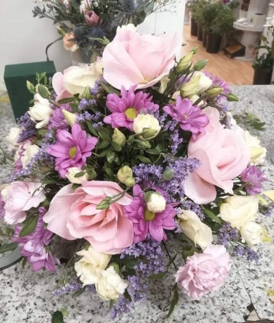 Lilac Farewell Posy - A graceful funeral posy in soft pink, purple and cream tones, thoughtfully arranged to create a beautiful tribute.