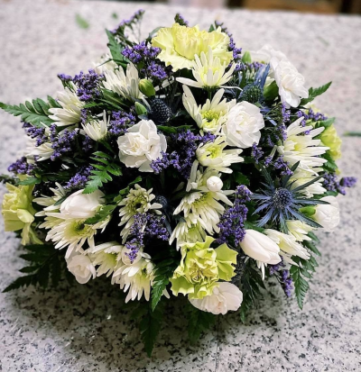 Peaceful Memories - A graceful funeral posy in fresh white, soft green and purple tones, thoughtfully arranged as a beautiful tribute.
