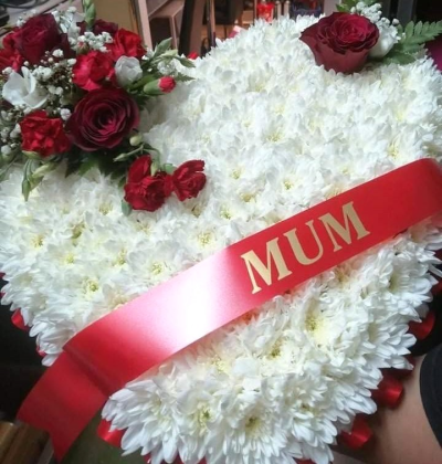 Loving Heart Tribute - A classic funeral heart in crisp white and deep red tones, thoughtfully arranged as a beautiful and heartfelt tribute.